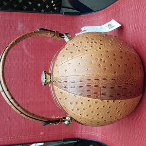 Purse (vegan). Round. Conversation piece. New with tags.